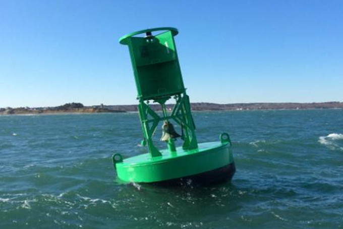 How does a bell buoy work in the sea?